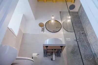 a bathroom with a sink and a shower at caZÁ ~ Palermo in Palermo