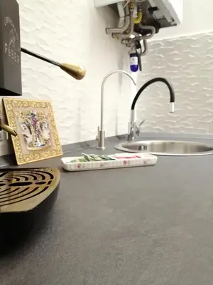a kitchen counter with a sink and a sink at Suites Masculu & Fimmina in Palermo