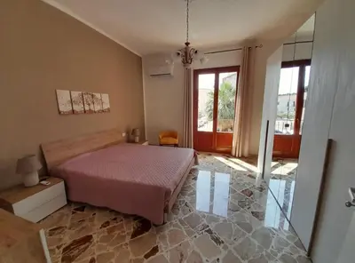 a bedroom with a bed and a glass floor at little Italy in Castellammare del Golfo