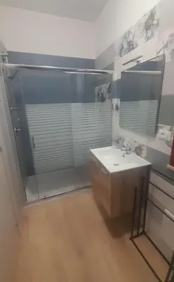 a bathroom with a shower and a sink and a mirror at little Italy in Castellammare del Golfo