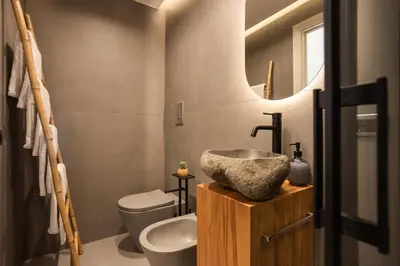 a bathroom with a sink and a toilet and a mirror at Le Terrazze dei Candelai 