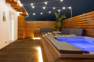a room with a hot tub and a patio at Le Terrazze dei Candelai 