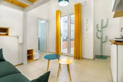 a living room with a couch and a table at Curtigghiu Mondello in Mondello