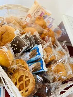 a basket full of pastries and waffles and cookies at Affittacamere Palermo Pirri in Palermo