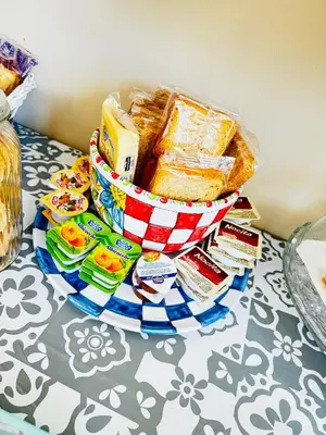 a basket of bread and other snacks on a table at Affittacamere Palermo Pirri in Palermo