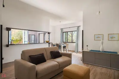 a living room with a couch and a table at Stunning seaview villa in Altavilla Milicia