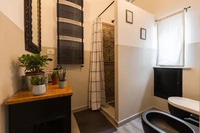 a bathroom with a sink and a mirror at ELLY HOLIDAY HOUSE in Palermo