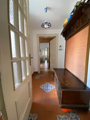a hallway with a door and a tile floor at Quiet and comfortable apartment in Palermo city centre in Palermo