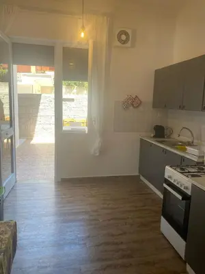 a kitchen with a stove and a counter top at Villa Eufrosine in Palermo