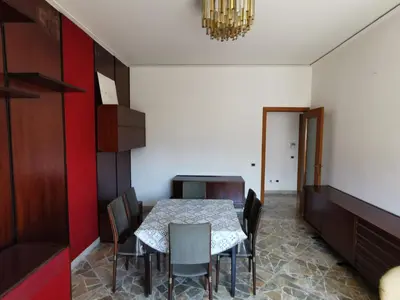 a dining room with a table and chairs at La Casa del Capo in Palermo