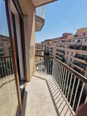 a balcony with a view of some buildings at La Casa del Capo in Palermo