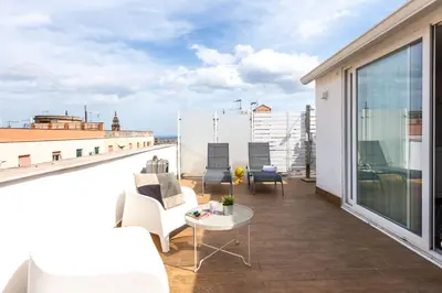 a balcony with a view of the ocean on a building at Vista sulle Cupole by Wonderful Italy in Palermo