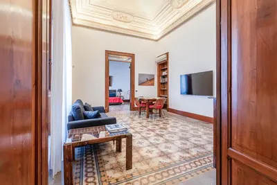a living room with a couch and a table at Lea's Luxury Art Apartment by Wonderful Italy in Palermo