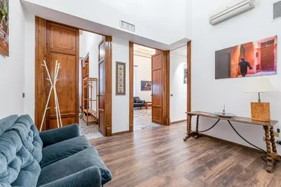 a living room with a couch and a table at Lea's Luxury Art Apartment by Wonderful Italy in Palermo