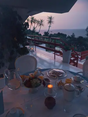 a table with food on it with a view of the ocean at Sea apartment & pool 2 in Palermo