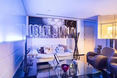 a living room with a couch and a glass table at Luxury suite 2 min dal Politeama - Free Parking in Palermo