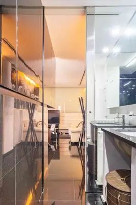 a kitchen with a glass door and a counter at Luxury suite 2 min dal Politeama - Free Parking in Palermo