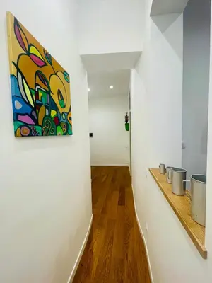 a hallway with a painting on the wall at Da Olga in Palermo