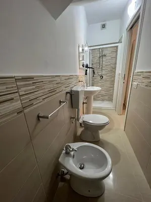 a bathroom with a toilet and a sink at B&B Marco Polo in Terrasini