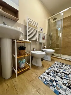 a bathroom with a sink and a toilet and a shower at D'Aragona Guest House in Palermo