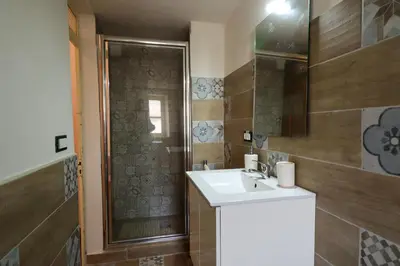 a bathroom with a sink and a shower at Holiday House Marconi in Castellammare del Golfo