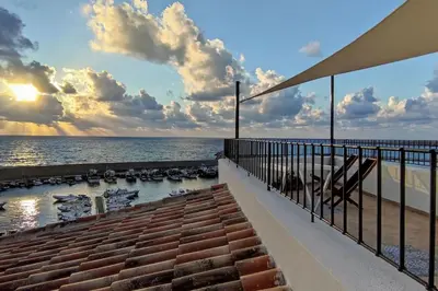 a view of the ocean from the balcony of a house at Casa del Pescatore Terrasini in Terrasini