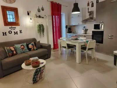 a living room with a couch and a table at Peri Peri House - Palermo Centro in Palermo
