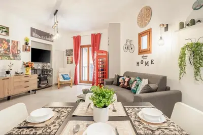 a living room with a couch and a table at Peri Peri House - Palermo Centro in Palermo