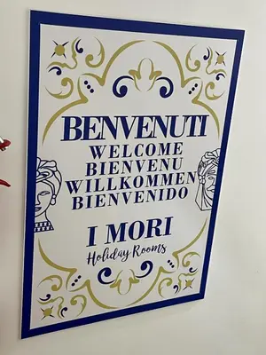 a sign on a wall that reads farewell welcomehtarorenoren blremember i moth at I MORI - Holiday Rooms in Lascari