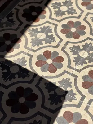 a tile floor with a pattern of flowers on it at Casa Stella Splendida Villa sul Mare in Palermo
