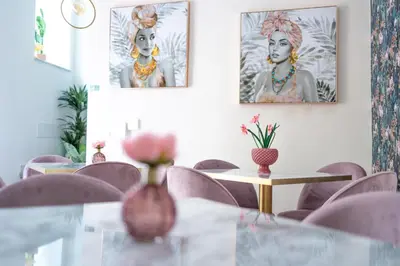 a dining room with a glass table and purple chairs at Borgo La Chiusa in Cinisi
