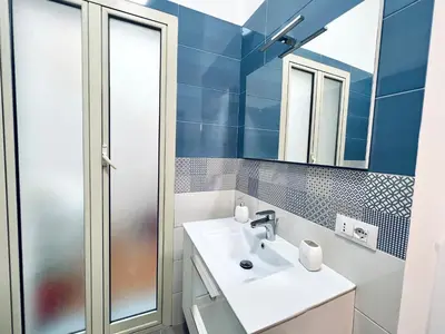 a bathroom with a sink and a shower at Domus Aurea in Isola delle Femmine