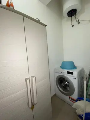 a laundry room with a washer and a washing machine at CasALE Sampó in Palermo