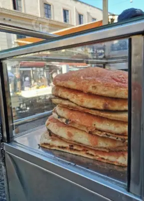 a stack of pancakes on top of a food cart at CasALE Sampó in Palermo