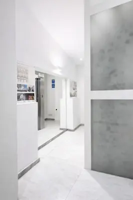 an empty hallway with white walls and white floors at Palazzo Moncada appartamento 2 in Palermo