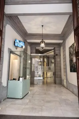 a hallway in a building with a ceiling at Palazzo Moncada appartamento 2 in Palermo