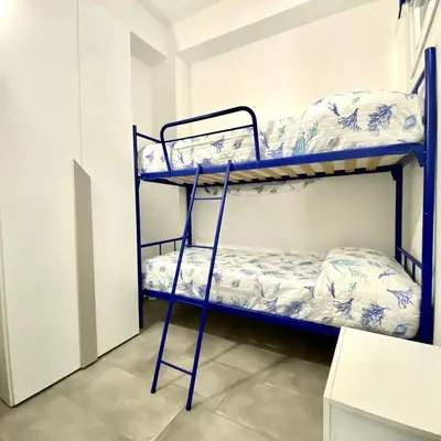 a bunk bed room with two bunk beds at Appartamento Alexa in Castellammare del Golfo