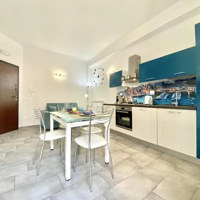 a kitchen and dining room with a table and chairs at Appartamento Alexa in Castellammare del Golfo