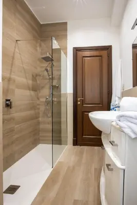 a bathroom with a shower and a sink at Gardenia Home in Palermo