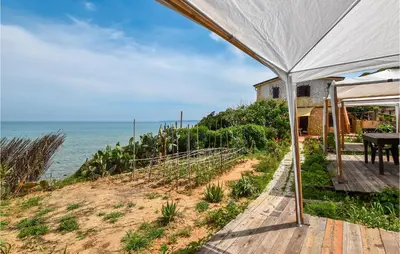 a view of the ocean from the porch of a house at Awesome Home In Trappeto With Wifi in Trappeto