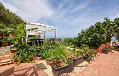 a garden with plants and a gazebo at Awesome Home In Trappeto With Wifi in Trappeto