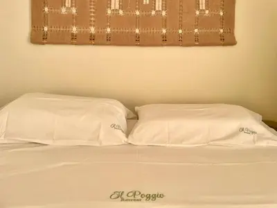 two white pillows sitting on top of a bed at Il Poggio Retreat - Cefalù in Cefalù