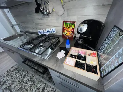 a kitchen counter with a stove and a stove top at Casa Il Tramonto by Holiday World in Balestrate