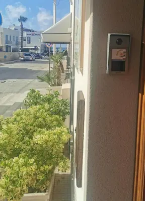 a window on the side of a building with plants at Il Giardino del Sol in San Vito lo Capo