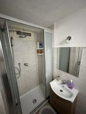 a bathroom with a shower and a sink at Appartamento Olivuzza House in Palermo