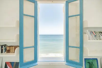 an open window with a view of the ocean at Tonnara Foderà di Magazzinazzi in Alcamo