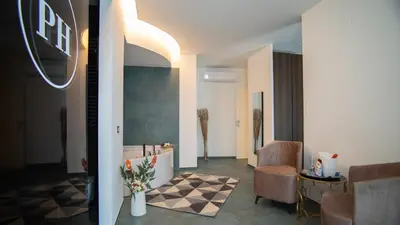 a lobby with a room with a tub and chairs at Palermo Historia in Palermo