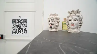 two statues sitting on a table in a room at Palermo Historia in Palermo