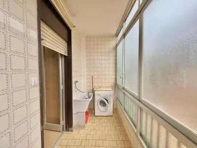 a bathroom with a toilet and a washing machine at La casetta di Alice in Palermo
