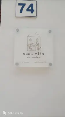 a kitchen with a bowl of fruit on a table at casa vacanze Vita 2 in Balestrate